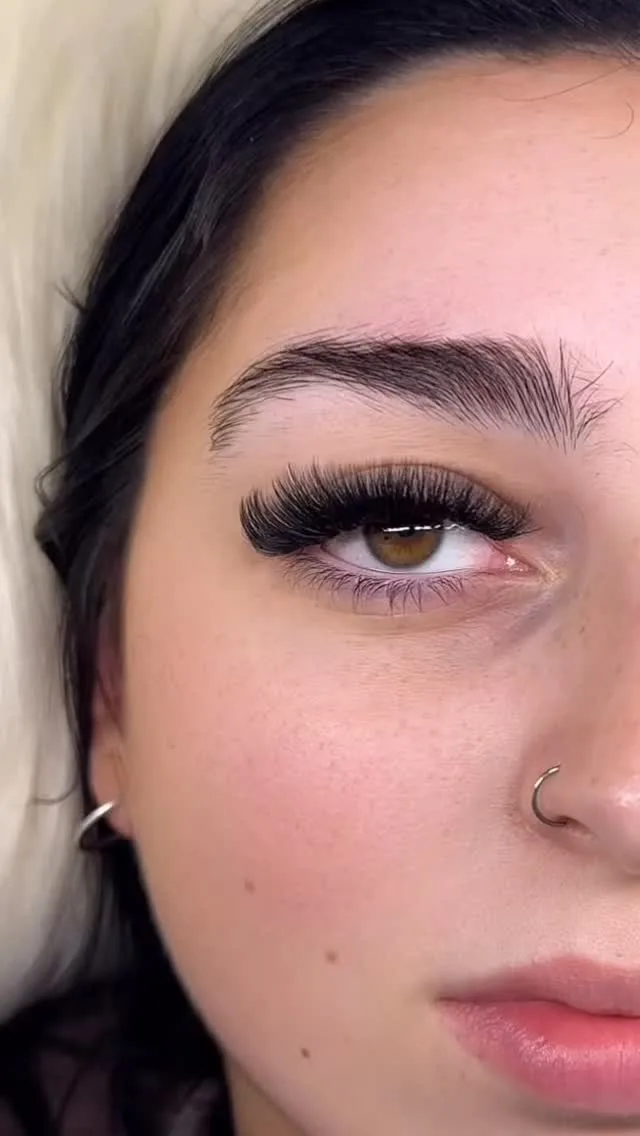 Dramatic volume lash extensions, half-face close-up